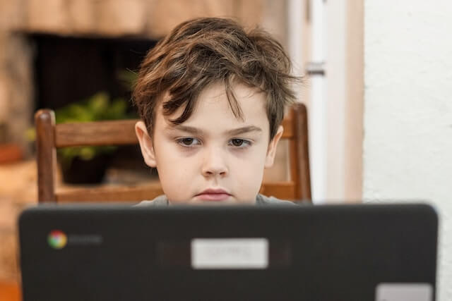 Child engaging in virtual therapy session 