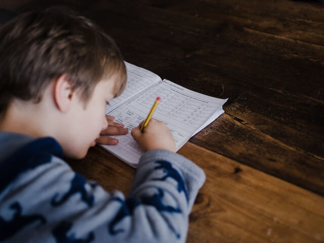 a child with autism doing his homework | Understanding IEPs for Parents of Children with Autism