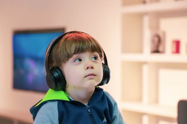 Child with autism enjoys holiday by listening to music, overthinking 