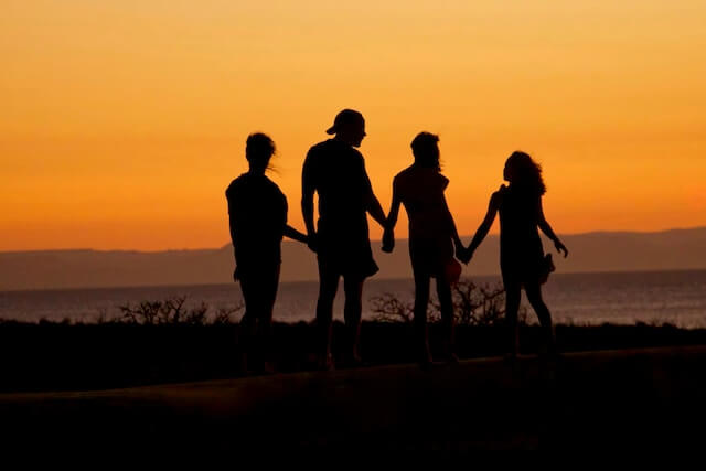 Silhouette of young and older kids |Social Group Benefits for Older Kids