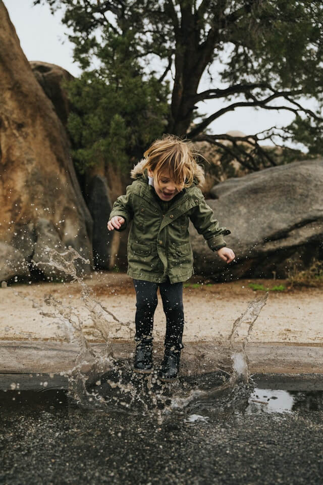 Boy enjoys playing in water | Why Autonomy Matters for Children with Autism