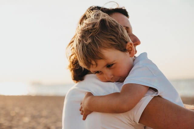 Mother holding baby | The History of Applied Behavior Analysis