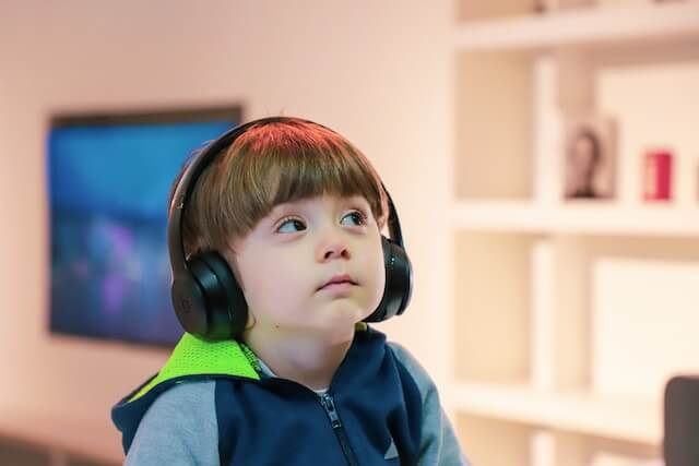 Child with autism enjoys holiday by listening to music, overthinking